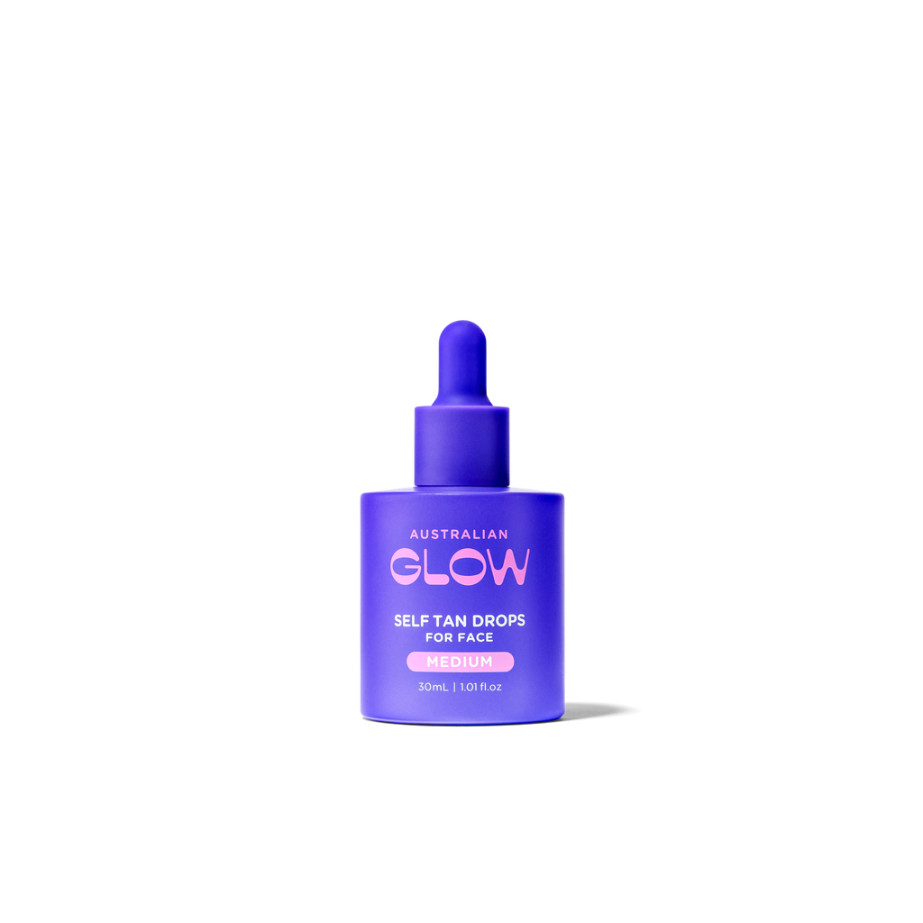 Face Tan Drops dropper bottle on cream background